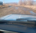 Разбитая дорога в поселке у Тишинской ГЭС